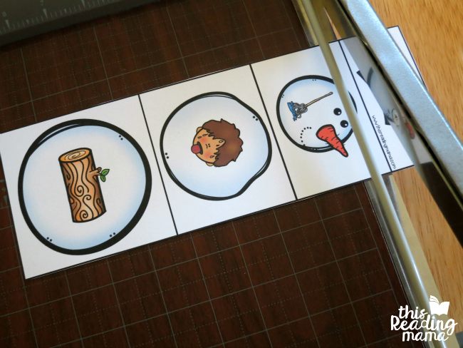 cutting out snowmen with paper cutter